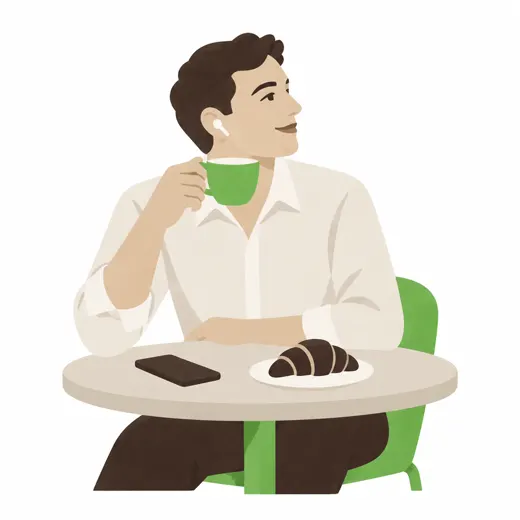Un homme boit son café, des écouteurs aux oreilles, le téléphone posé sur la table.